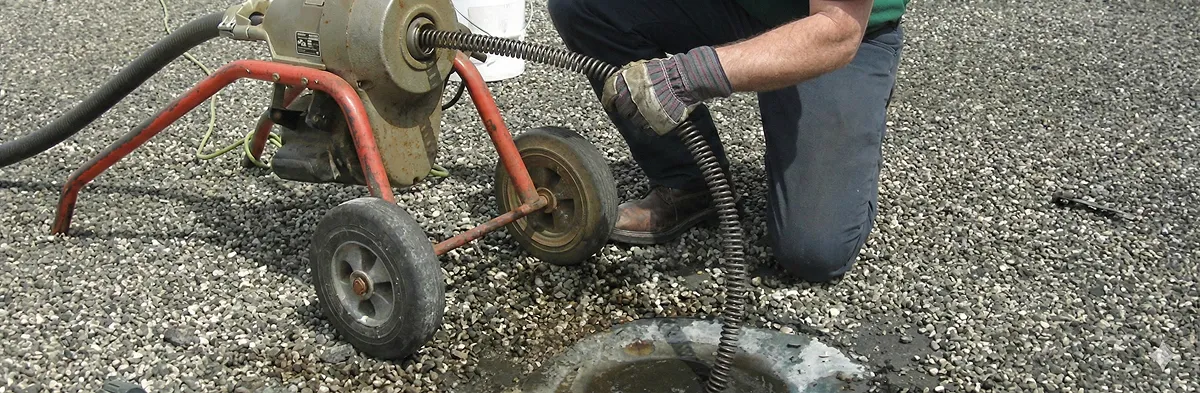 sewer rodding technician actively removing blockages from a sewer line in Allentown, PA